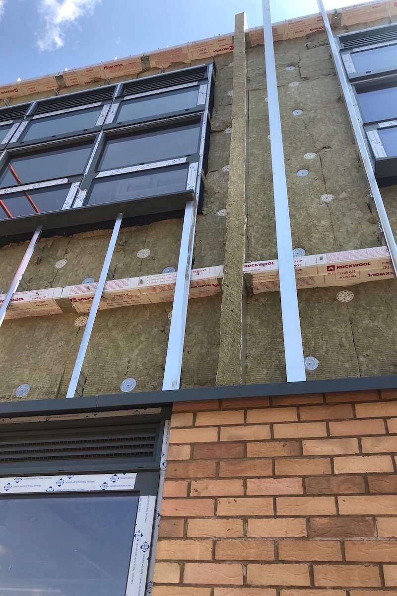 Horizontal & Vertical fire barrier installation before rainscreen façade installed