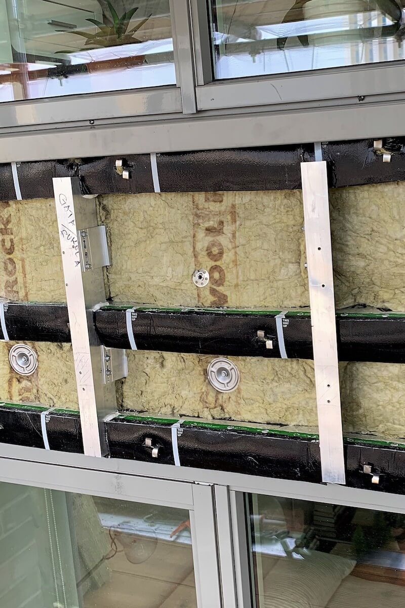 Firebreaks installed to slap and window level awaiting faced installation